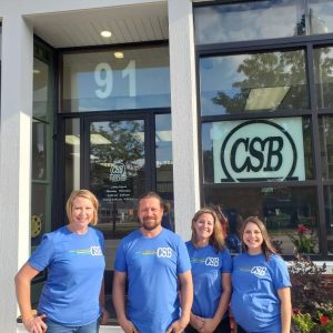 CSB Elkhart Lake employees in front of temporary building during CSB Anniversary